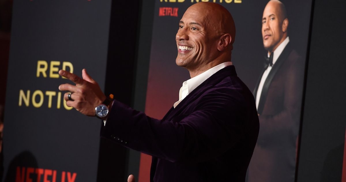 Actor Dwayne Johnson is seen at the Los Angeles premiere of "Red Notice" Nov. 3. Johnson donated his own customized pickup truck to a Navy veteran as part of the promotional activities for the new movie.