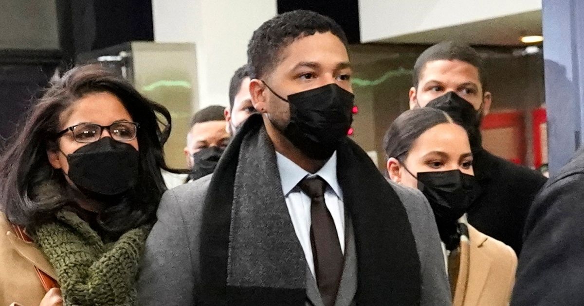 Jussie Smollett, center, is escorted out of Leighton Criminal Courthouse in Chicago, Illinois, on Thursday after being found guilty on 5 of 6 felony charges.