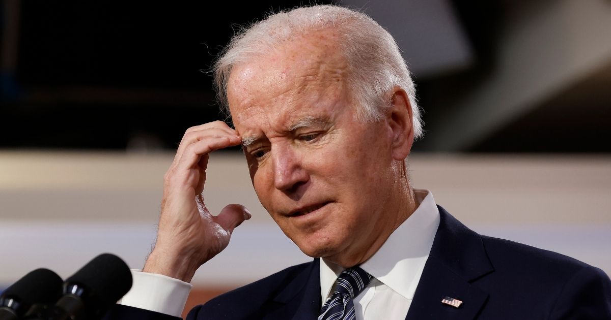 President Joe Biden scratches his head during the White House's virtual Summit For Democracy in the Eisenhower Executive Office Building in Washington on Friday.