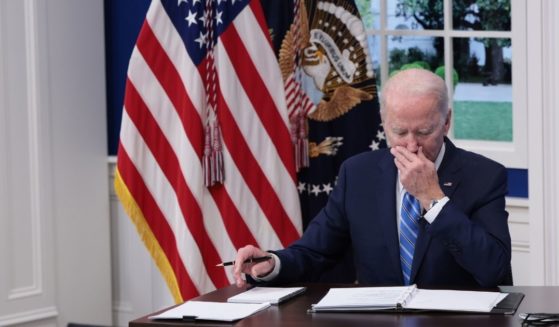 President Joe Biden listens during a video call at the Eisenhower Executive Office Building on Monday in Washington, D.C.