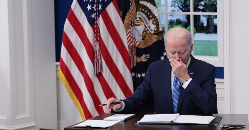 President Joe Biden listens during a video call at the Eisenhower Executive Office Building on Monday in Washington, D.C.