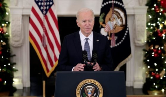 President Joe Biden delivers remarks in the State Dining Room of the White House on Friday in Washington, D.C.