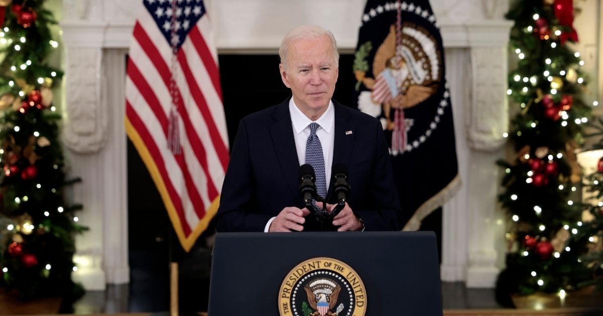 President Joe Biden delivers remarks in the State Dining Room of the White House on Friday in Washington, D.C.