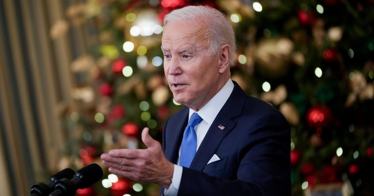 President Joe Biden speaks about the omicron variant of the coronavirus in the State Dining Room of the White House on Tuesday in Washington, D.C.