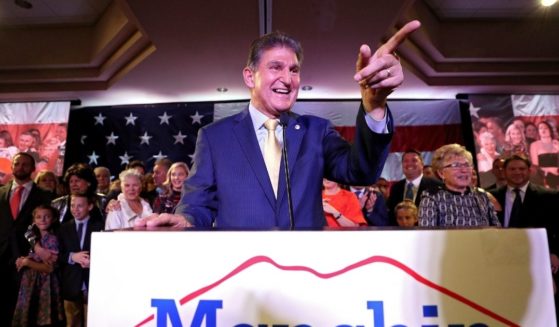 Democratic Sen. Joe Manchin of West Virginia celebrates at his election day victory party at the Embassy Suites on Nov. 6, 2018, in Charleston, West Virginia.