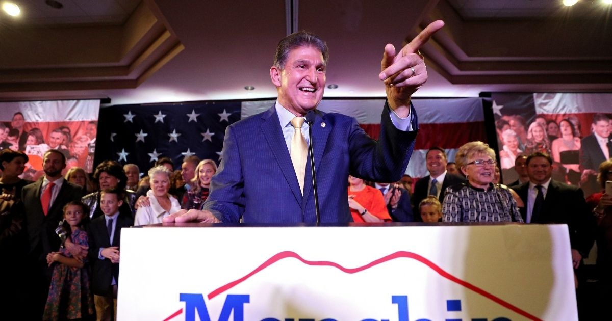 Democratic Sen. Joe Manchin of West Virginia celebrates at his election day victory party at the Embassy Suites on Nov. 6, 2018, in Charleston, West Virginia.