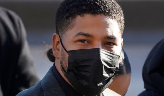 Actor Jussie Smollett prepares to enter the Leighton Criminal Courthouse in Chicago, Illinois, on Tuesday for day two of his trial for lying to the police.