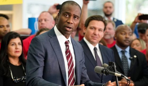 Florida Surgeon General Dr. Joseph A. Ladapo, flanked by Gov. Ron DeSantis, is seen in a file photo from November. Ladapo has called upon the federal government to resume shipments of the life-saving COVID drug Regeneron.