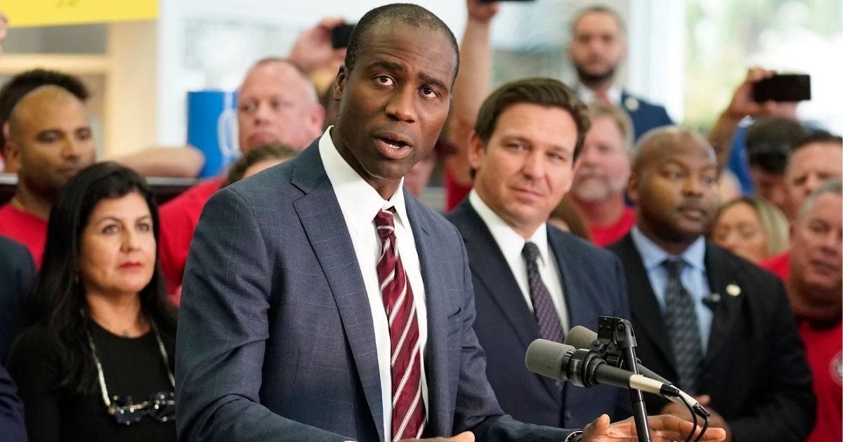 Florida Surgeon General Dr. Joseph A. Ladapo, flanked by Gov. Ron DeSantis, is seen in a file photo from November. Ladapo has called upon the federal government to resume shipments of the life-saving COVID drug Regeneron.