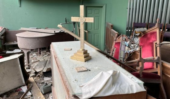An altar carved with an image of the Last Supper remains intact after a tornado tore through a church in Mayfield, Kentucky.