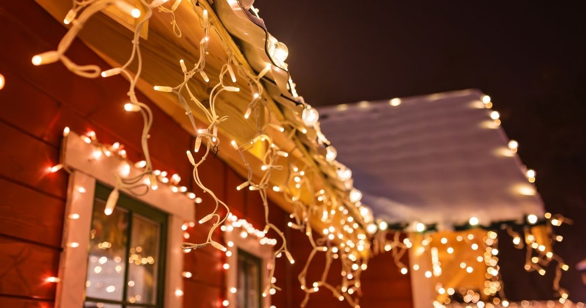 This stock image shows Christmas lights hanging from the roof of a house. Donna Sanginario of Lancaster, Massachusetts, got an unexpected surprise when attempting to put up her Christmas lights this year.