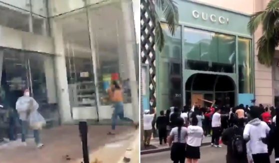 Looters are seen taking items from upscale Beverly HIlls stores in May of 2020. A drastic increase in lawlessness, including murders, assaults and other violent crime, has prompted many left-leaning Californians to re-think their stance on gun ownership.