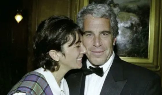 Ghislaine Maxwell, left, is photographed with Jeffrey Epstein, right, in one of several photos the defense team for Maxwell did not want used as evidence in the trial.