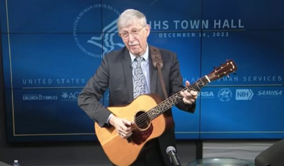 Outgoing National Institutes of Health Director Dr. Francis Collins strums a guitar while singing a pandemic-themed parody of "Somewhere Over the Rainbow."