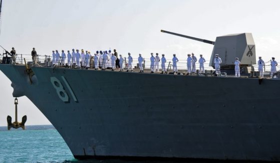 US sailors stand aboard the missile destroyer USS Winston Churchill as it anchors in Port Sudan on March 1.
