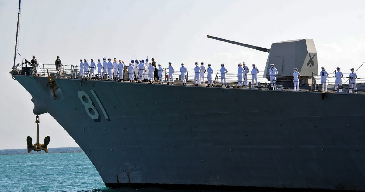 US sailors stand aboard the missile destroyer USS Winston Churchill as it anchors in Port Sudan on March 1.