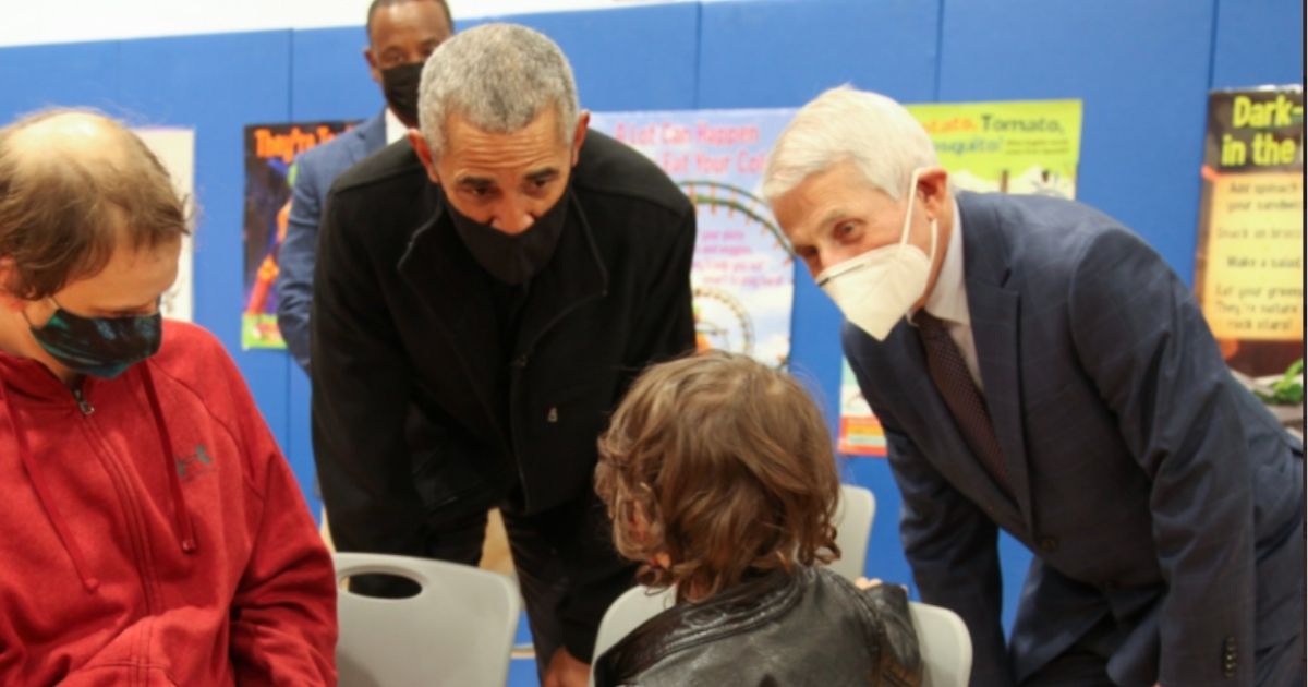 Former President Barack Obama, middle, and Dr. Anthony Fauci, right, visited Kimball Elementary School in Washington, D.C., on Tuesday to encourage young children to get the COVID-19 vaccination.