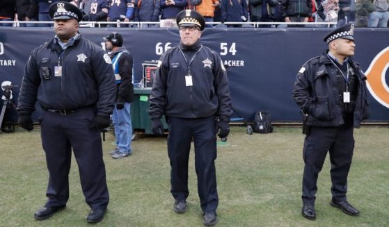 Chicago police officers stand on the sidelines at Soldier Field to provide game security for the Chicago Bears and Philadelphia Eagles playoff game on Jan. 6, 2019.