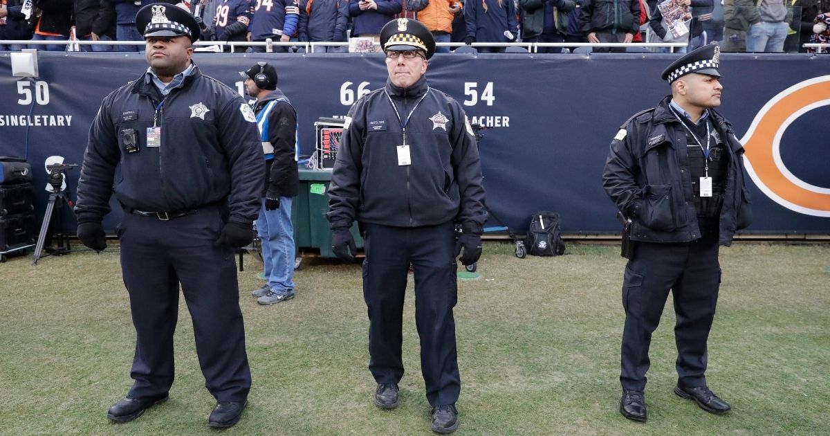 Chicago police officers stand on the sidelines at Soldier Field to provide game security for the Chicago Bears and Philadelphia Eagles playoff game on Jan. 6, 2019.