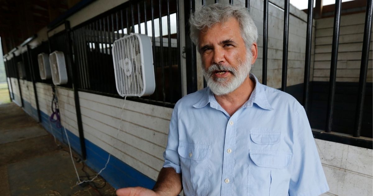 Dr. Robert Malone gestures as he stands in his barn on his horse farm on July 22, 2020, in Madison, Virginia.