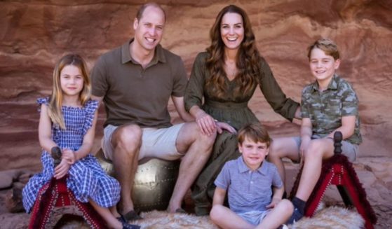 Prince William and Kate Middleton pose with their children for a Christmas card.