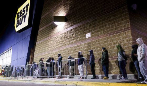 Black Friday shoppers wait in line for Best Buy to open on Friday in Westminster, Colorado.
