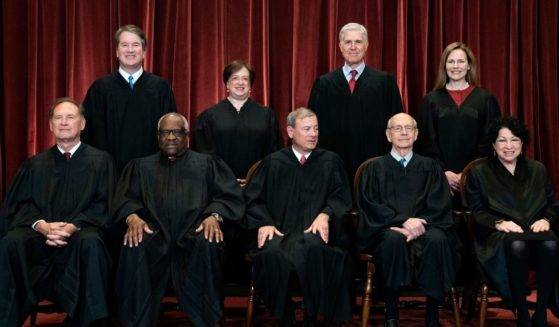 In this April 23 file photo, members of the Supreme Court pose for a group photo at the Supreme Court in Washington, D.C.