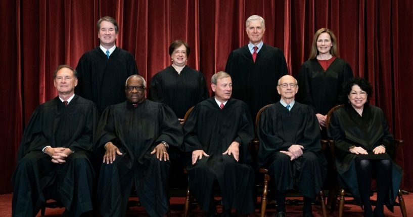In this April 23 file photo, members of the Supreme Court pose for a group photo at the Supreme Court in Washington, D.C.