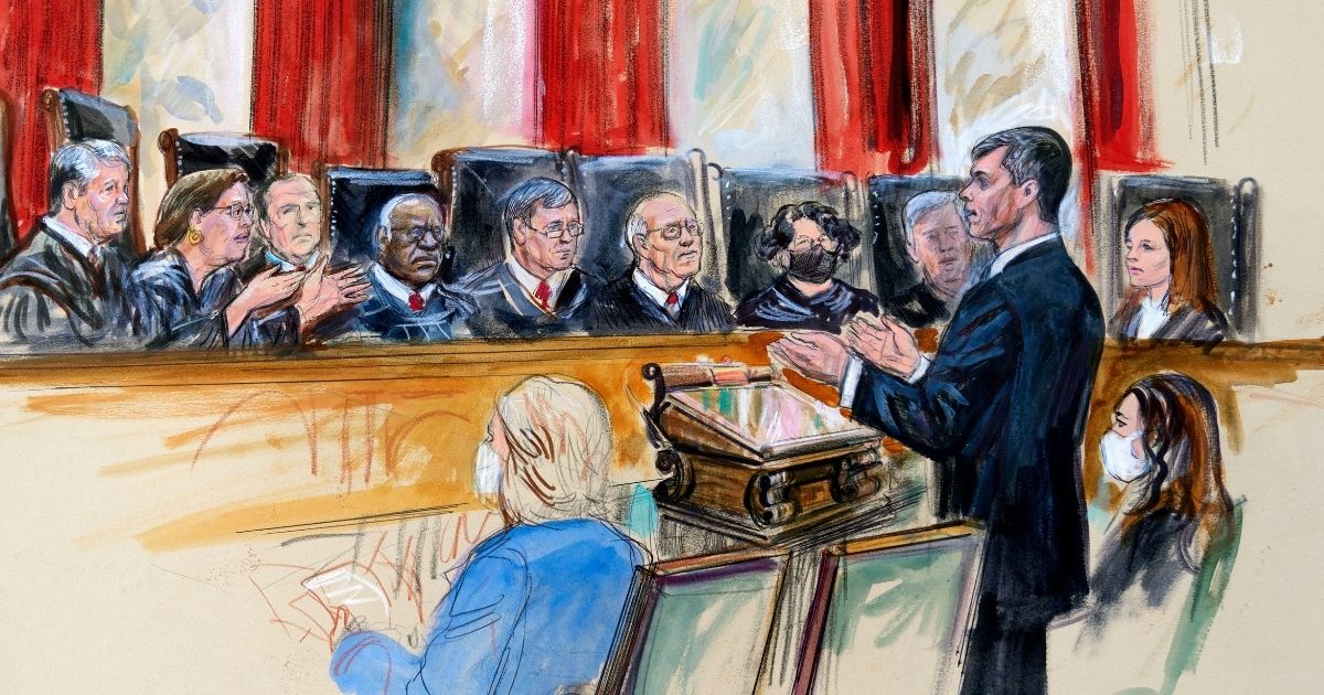 An artist's sketch depicts Mississippi Solicitor General Scott Stewart standing while speaking to the Supreme Court in Washington. Center for Reproductive Rights Litigation Director Julie Rikelman is seated right. The court has been considering Dobbs v. Jackson Women's Health Organization, which focuses on Mississippi's ban on abortions after 15 weeks' gestation.