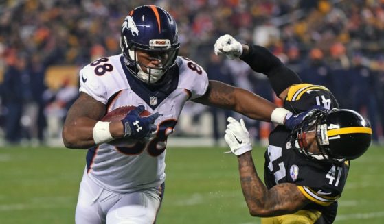 Wide receiver Demaryius Thomas of the Denver Broncos stiff-arms cornerback Antwon Blake of the Pittsburgh Steelers as he scores a touchdown at Heinz Field on Dec. 20, 2015.