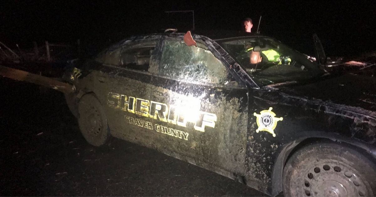 Two police officers were caught in their vehicles when the Tornado hit Mayfield, Kentucky, causing severe damage to patrol cars. After leaving their vehicles to seek shelter in a home, they came across a young girl in need of emergency assistance.