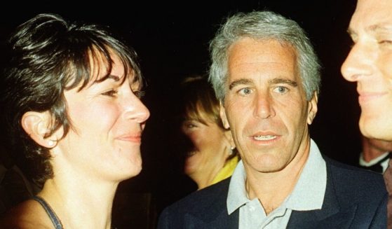 Ghislaine Maxwell and the now-deceased Jeffrey Epstein are pictured in file photo from February 2000 at the Mar-a-Lago club, Palm Beach, Florida.