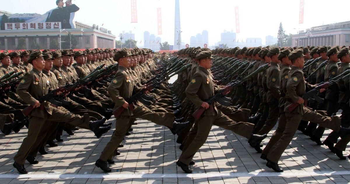 North Korean troops march during a military parade in 2013 in Pyongyang to mark the 65th anniversary of the country's founding. In another show of might in the communist nation, a North Korean man reportedly was sentenced to death recently for having the Netflix show 'Squid Game' saved on his flash drive and selling copies.