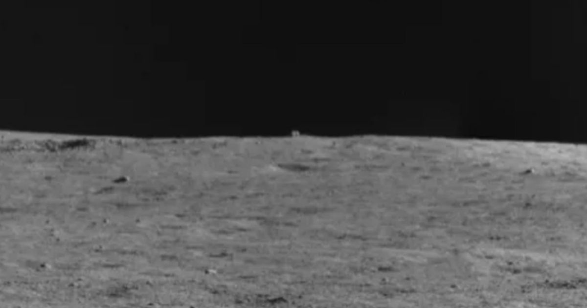 The cube-shaped object in the distance, near the middle of the photo, is the 'mystery hut' that China's Yutu-2 moon rover is investigating. The rover is inching closer to the object, a journey that reportedly will take two to three months.