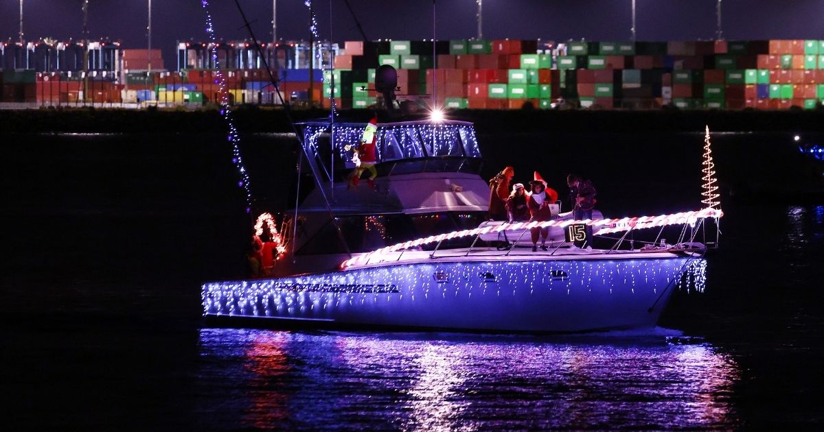 A Christmas boat parade takes place on Dec. 4, 2021, in San Pedro, California. A boat parade in Yorktown, Virginia, on the same day has stirred controversy for its political messaging.