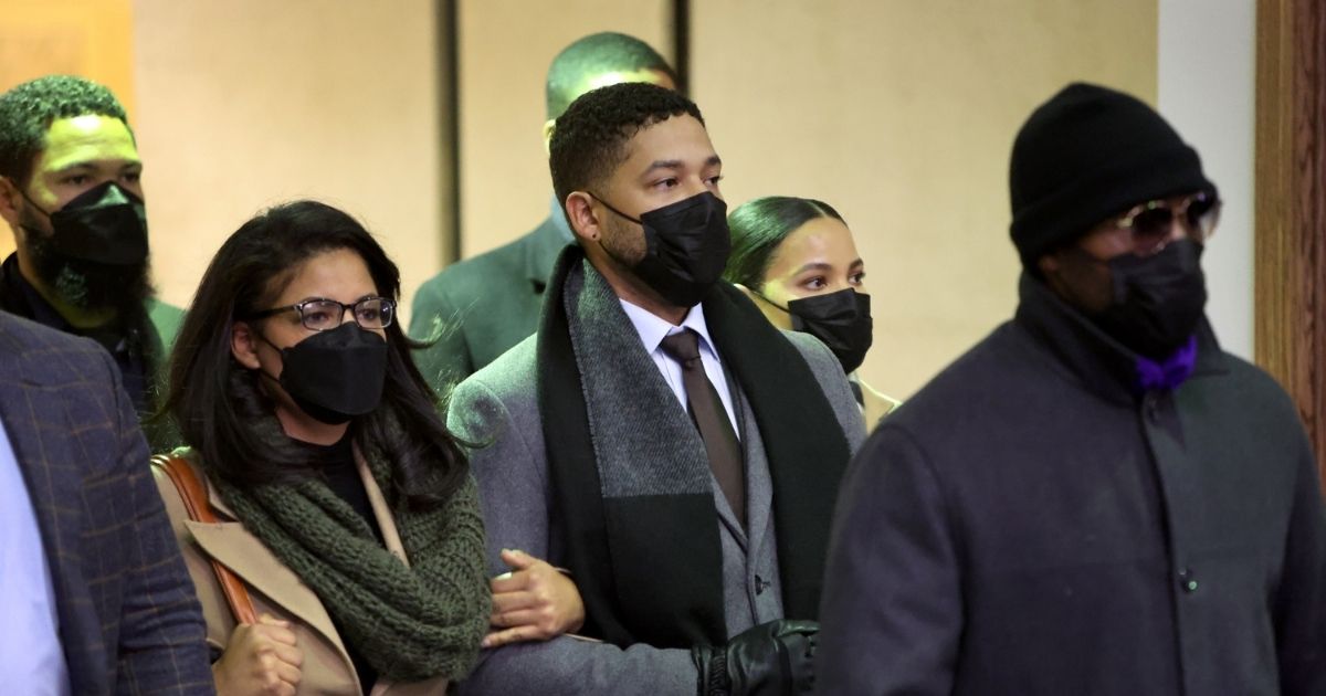 Former "Empire" actor Jussie Smollettleaves the Leighton Criminal Courts Building in Chicago on Thursday after being found guilty of five of the six counts against him related to staging an attack on himself in January 2019.