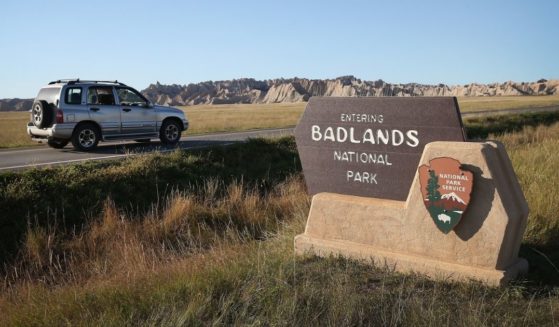 Visitors drive into the Badlands National Park near Wall, South Dakota, in 2013, a year before a paleontologist discovered the first piece of a Triceratops skeleton at the park.