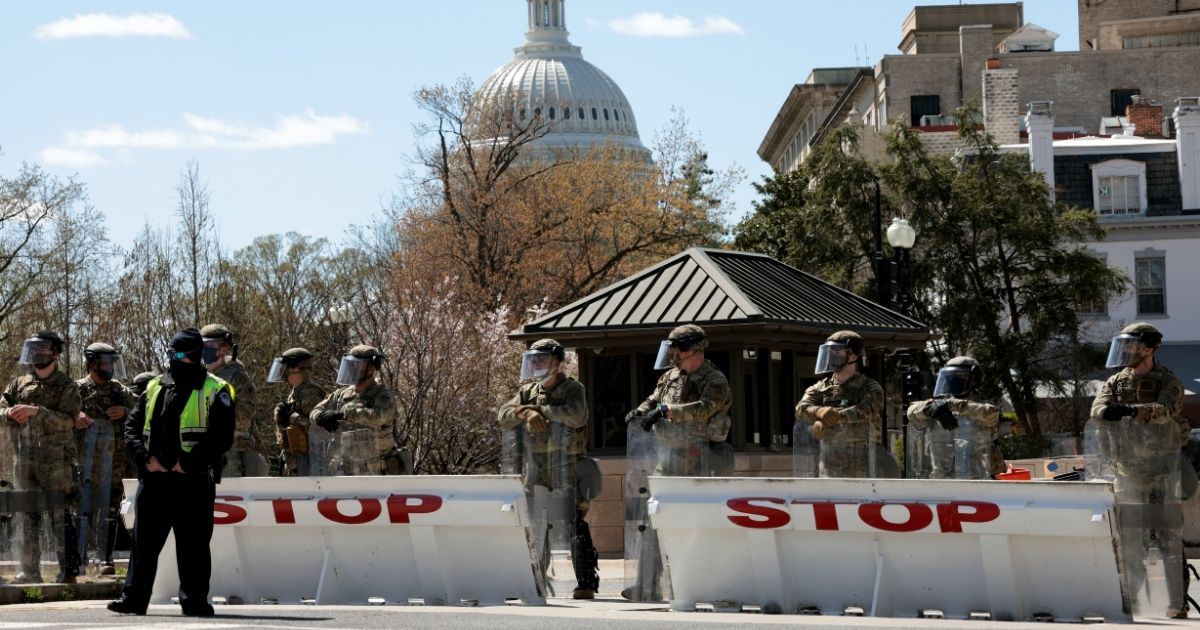 National Guard troops man their post outside the Capitol on April 2 after a vehicle charging a barricade rammed two Capitol Police officers.