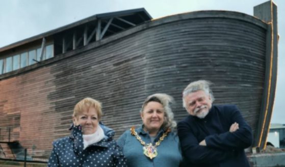 With biblical enthusiasts in the foreground, a half-sized replica of Noah’s Ark sits docked in Ipswich, England, in February 2020.