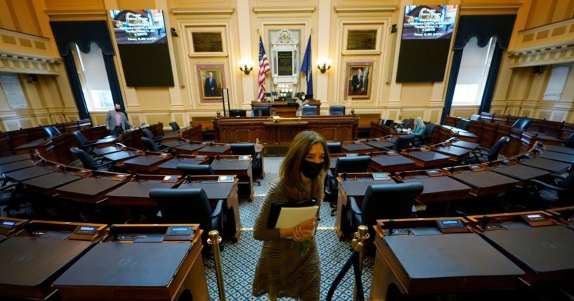 Democratic House speaker Del. Eileen Filler-Corn exits the center isle of the empty Virginia House of Delegates chamber after a Zoom Legislative session at the Capitol in Richmond, Virginia, on Feb. 10.