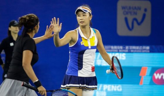 Sania Mirza of India and Shuai Peng of China celebrate a point during the ladies doubles semifinal of the Wuhan Open in Wuhan, China, on Sept. 29, 2017.