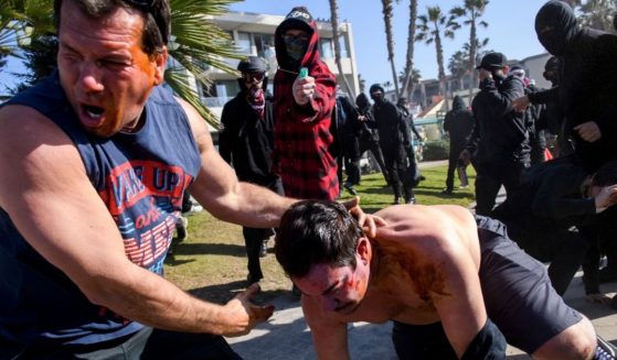 Antifa members attack supporters of former President Donald Trump on Jan. 9 in the Pacific Beach neighborhood of San Diego, California.