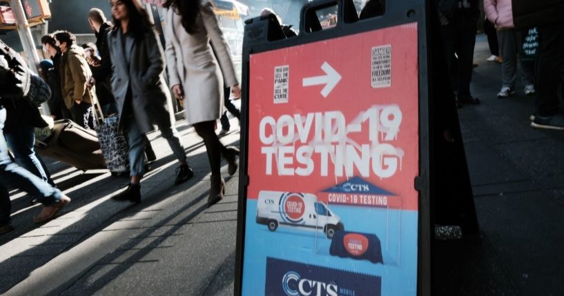 People line up to get tested for COVID-19 in Times Square on Dec. 5 in New York City.