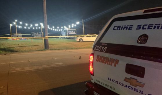 A shooter opened fire during a outside vigil for a murdered man on Sunday in Baytown, Texas, injuring 13 and killing one.