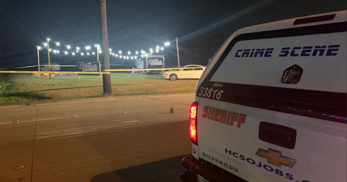 A shooter opened fire during a outside vigil for a murdered man on Sunday in Baytown, Texas, injuring 13 and killing one.