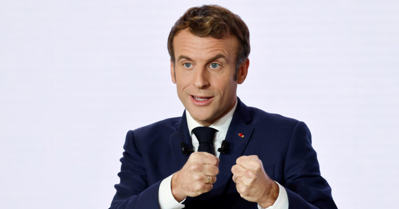 French President Emmanuel Macron gestures as he delivers a speech on Dec. 9, 2021, in Paris.