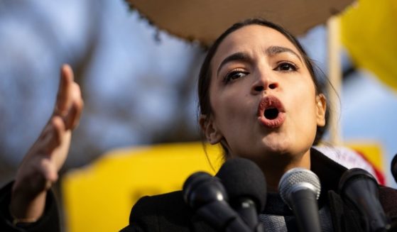 Rep. Alexandria Ocasio-Cortez speaks during a rally outside the U.S. Capitol on Dec. 7, 2021, in Washington, D.C.