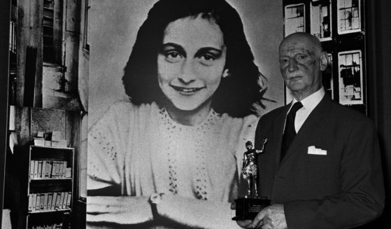 Dr. Otto Frank is seen in this file photo from 1971, holding the Golden Pan award given for the sale of one million copies of the famous paperback, 'The Diary of Anne Frank,' by Frank's daughter. The book told the true story of a Jewish family who went into hiding in 1942 in Amsterdam, where they remained undiscovered for two years. Dr. Frank was the family's only survivor. A team of investigators has revealed this week the name of the person who betrayed the family to the Nazis.