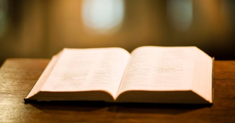 A Bible is seen on a church pulpit.