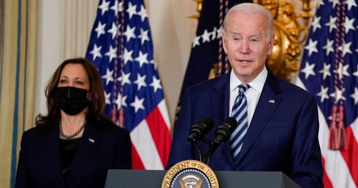 President Joe Biden, right, is joined by Vice President Kamala Harris, left, as he gives a speech before signing the "Protecting America's First Responders Act of 2021," the "Confidentiality Opportunities for Peer Support Counseling Act" and the "Jaime Zapata and Victor Avila Federal Officers and Employees Protection Act" in the State Dining Room of the White House on Nov. 18, 2021.